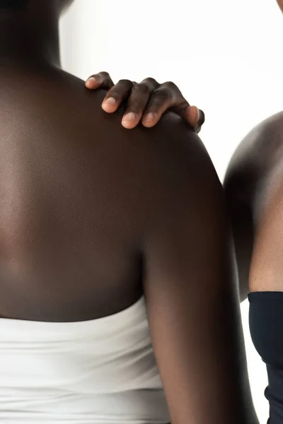Cropped view of african american women in tops isolated on grey — Stock Photo