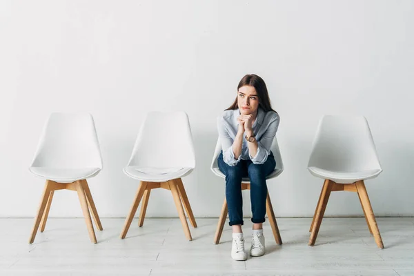 Thoughtful girl waiting for job interview in office — Stock Photo