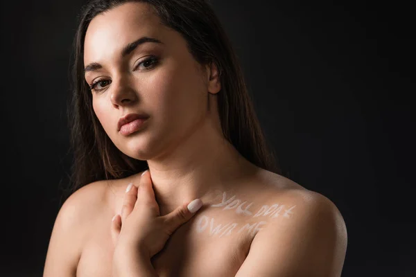 Portrait of pretty plus size girl with lettering You Don't Own Me on body isolated on black — Stock Photo