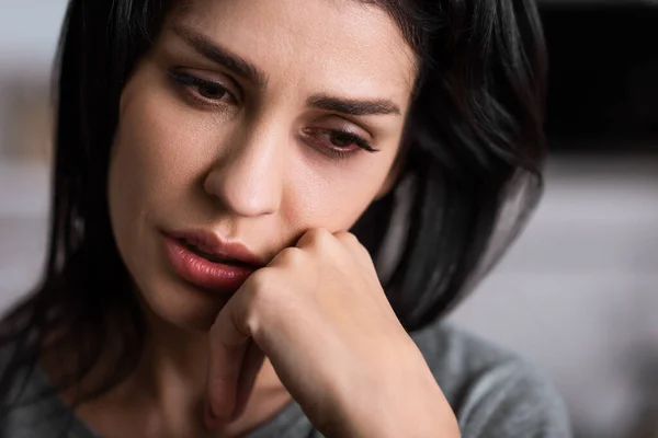 Close up of injured woman with bruise touching face, domestic violence concept — Stock Photo