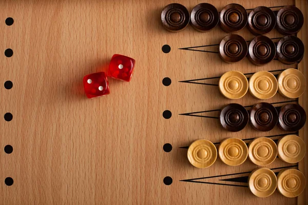 KYIV, UKRAINE - JANUARY 30, 2019: top view of wooden backgammon board, checkers and dice pair — Stock Photo