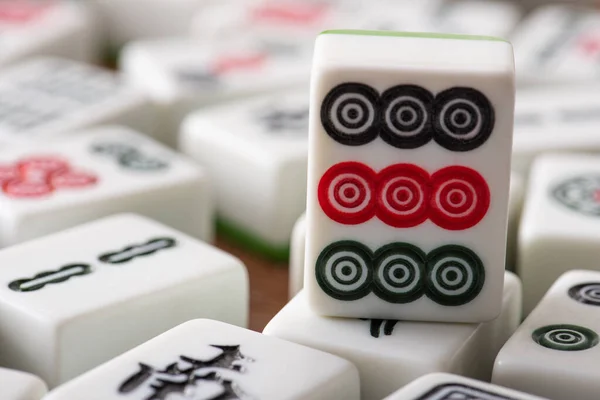 KYIV, UKRAINE - JANUARY 30, 2019: close up view of white mahjong game tile with dots ornate — стокове фото