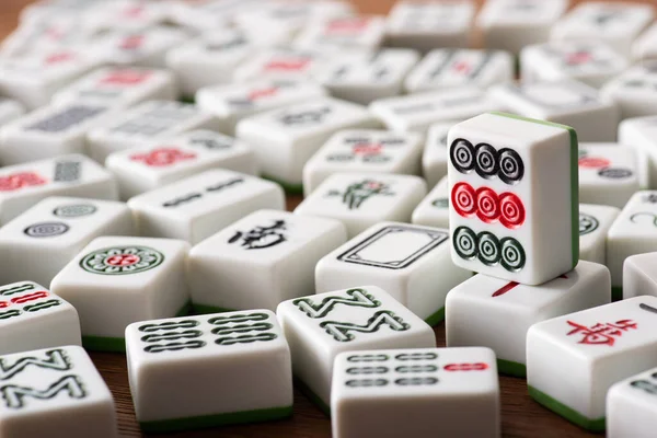 KYIV, UKRAINE - JANUARY 30, 2019: selective focus of white mahjong game tiles with signs and characters — Stock Photo