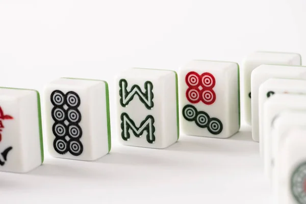 KYIV, UKRAINE - JANUARY 30, 2019: selective focus of mahjong game tiles with signs and characters on white background — Stock Photo