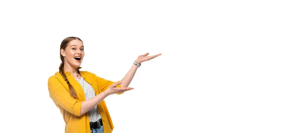 Excited pretty girl with braid pointing with hands aside isolated on white — Stock Photo