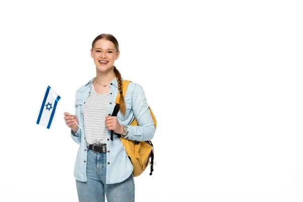 Smiling pretty student with backpack holding flag of Israel isolated on white — Stock Photo