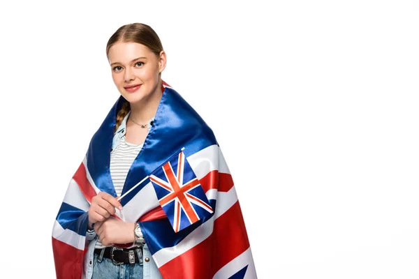 Lächelndes hübsches Mädchen mit Zopf und UK-Flaggen auf weißem Grund — Stockfoto
