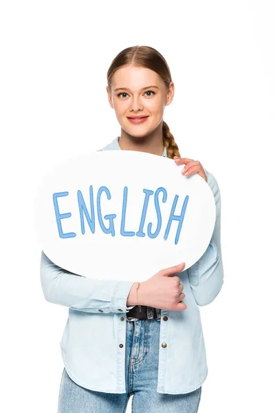 Fille souriante avec tresse tenant bulle de discours avec lettrage anglais isolé sur blanc — Photo de stock