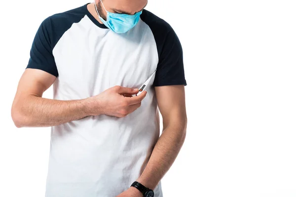 Ill man in medical mask holding digital thermometer isolated on white — Stock Photo