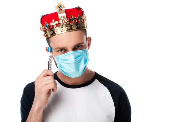 Man in medical mask and crown holding test tube with blood sample isolated on white — Stock Photo