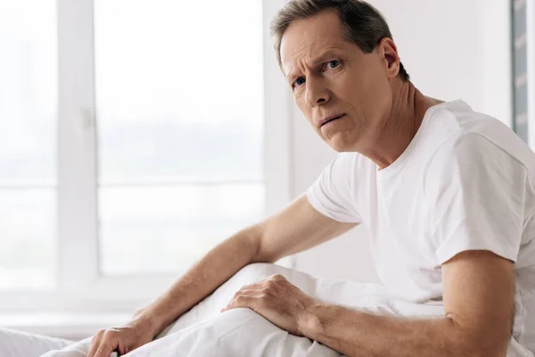 Depressed man feeling unwell and looking at camera — Stock Photo