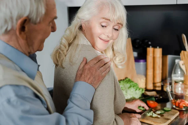 Happy senior couple cooking together on kitchen during self isolation — Stock Photo