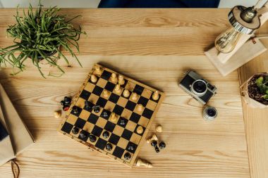 Chess game with vintage camera  clipart