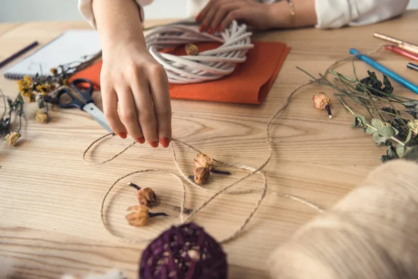 Hands with twine at workplace — Stock Photo, Image