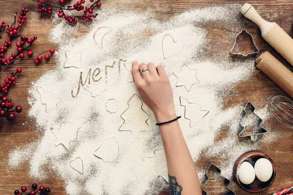 Merry christmas inscription in flour — Free Stock Photo