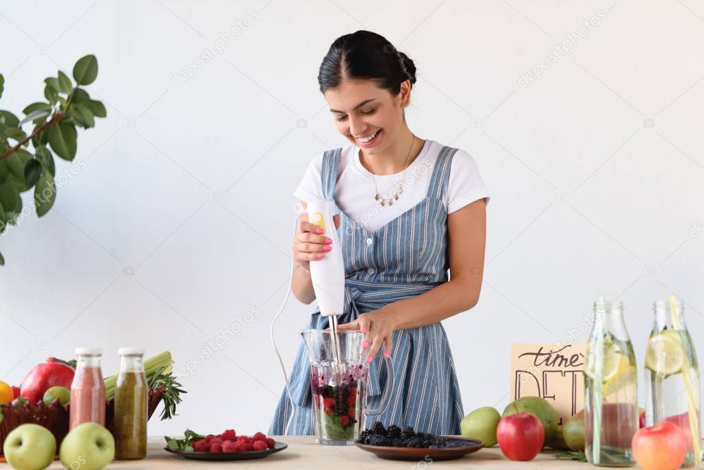 young woman making detox drink