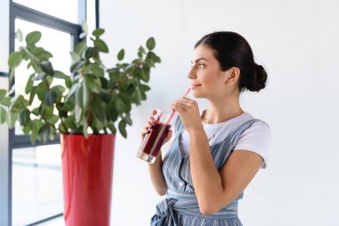 thoughtful woman with detox drink clipart