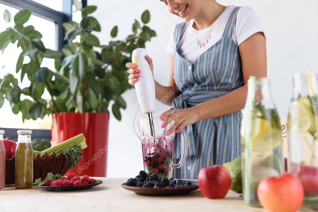 woman cooking detox drink