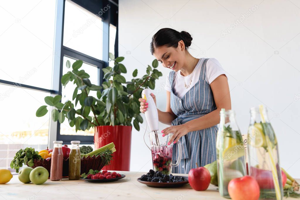 young woman making detox drink
