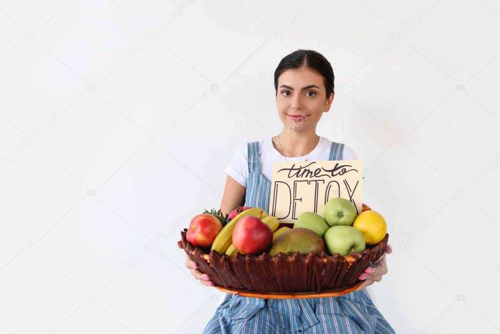 woman holding basket with harvest