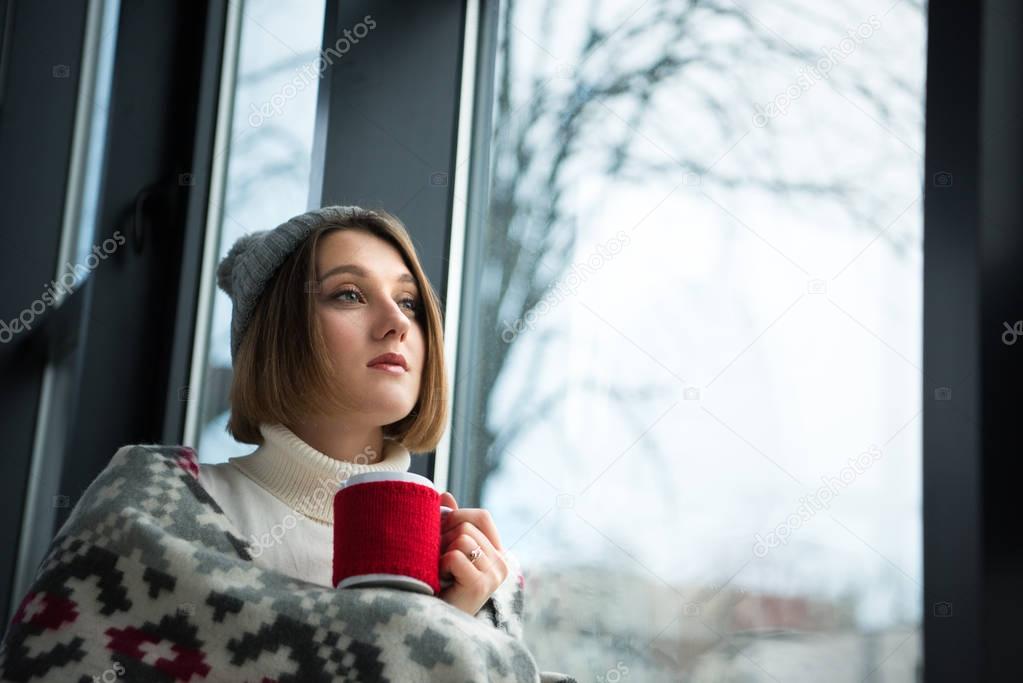 girl holding red cup