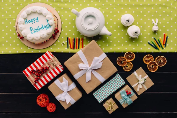 Present boxes and birthday cake — Stock Photo, Image