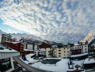 beautiful austrian town in snowy mountains clipart