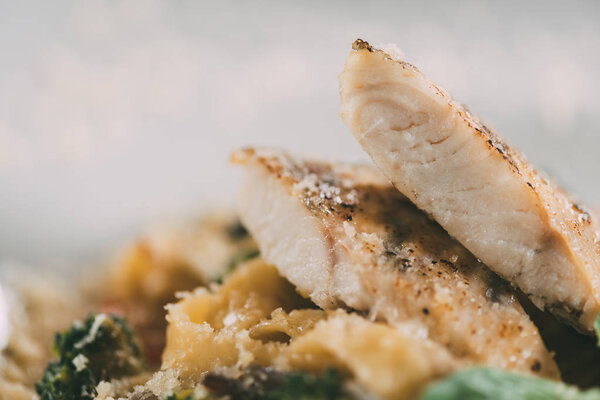 close-up view of delicious pasta with pike perch fillet and parmesan cheese   