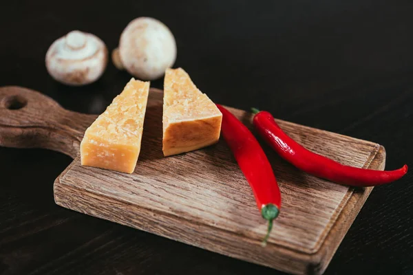 Parmesan Cheese Chili Peppers Wooden Cutting Board Mushrooms Table — Stock Photo, Image