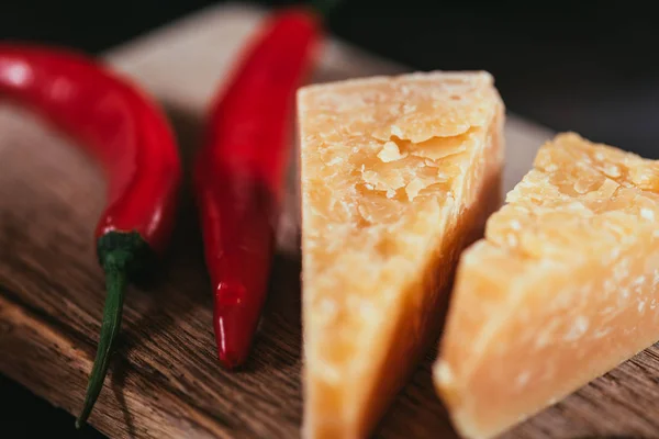 Close View Gourmet Parmesan Cheese Chili Peppers Wooden Cutting Board — Stock Photo, Image