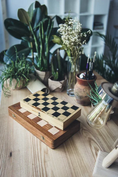 Artistic workplace with chess boards — Stock Photo