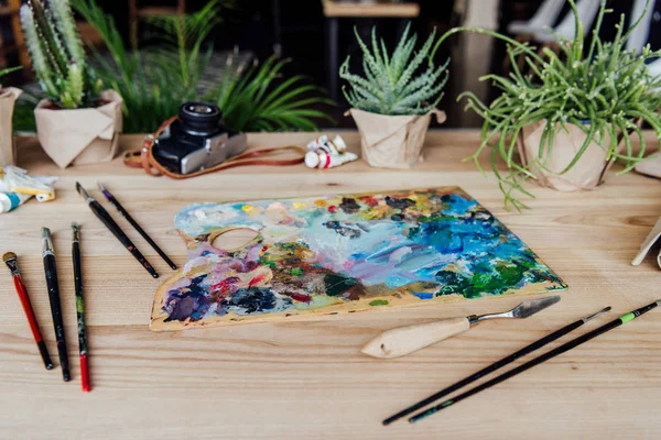 Creative workplace with art supplies — Stock Photo