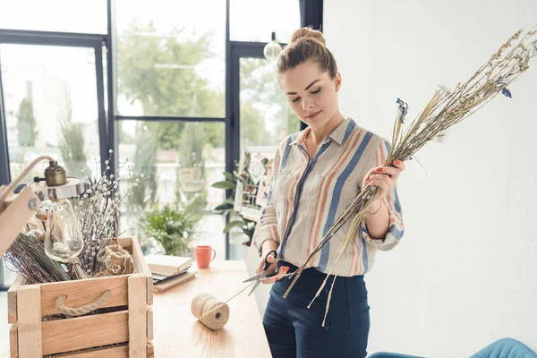 Decorator with flowers at workplace — Stock Photo