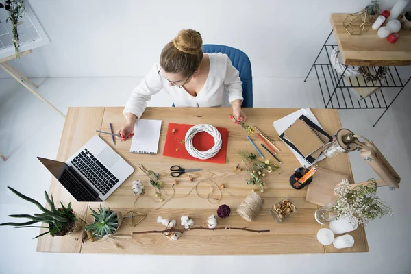 Female decorator at workplace — Stock Photo