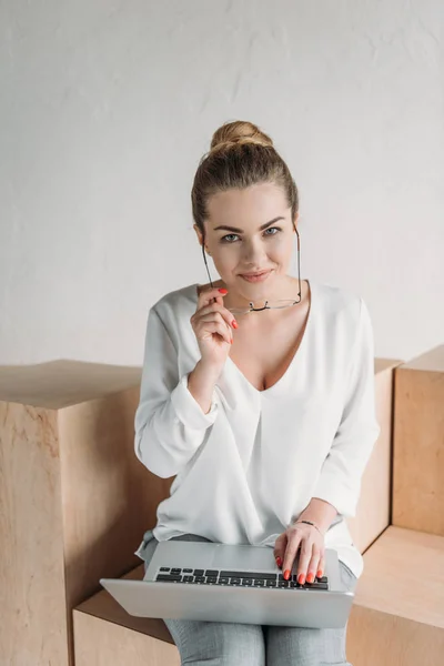 Beautiful businesswoman with laptop — Stock Photo