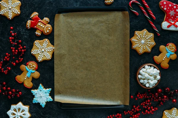 Gingerbreads around baking tray — Stock Photo