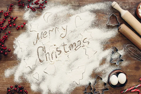 Merry christmas inscription in flour — Stock Photo