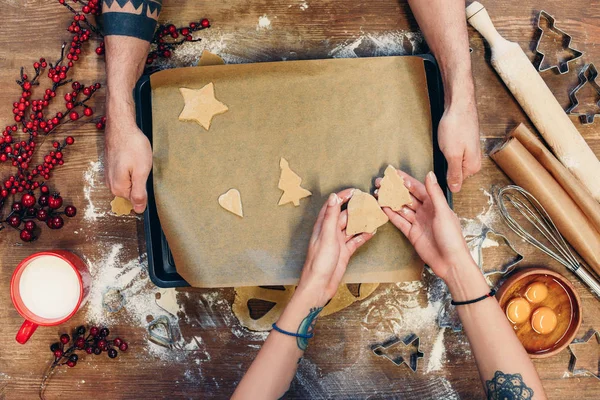 Christmas cookies on baking paper — Stock Photo