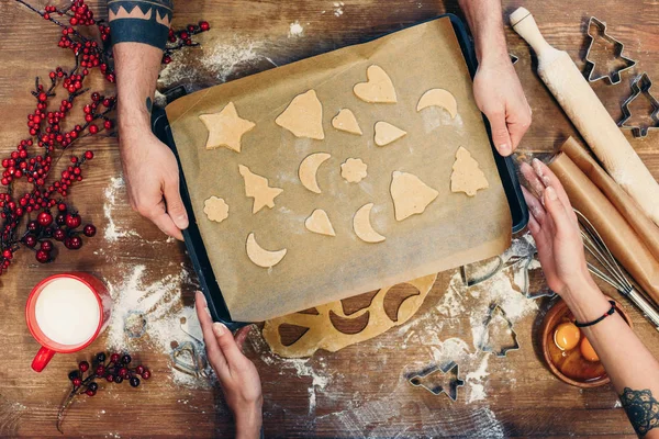 Christmas cookies on baking paper — Stock Photo