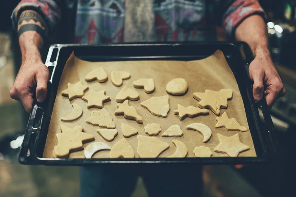 Person baking christmas cookies — Stock Photo