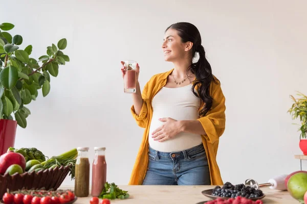 Pregnant woman with glass of detox drink — Stock Photo
