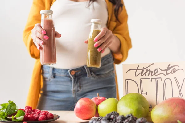 Pregnant woman with detox drinks — Stock Photo