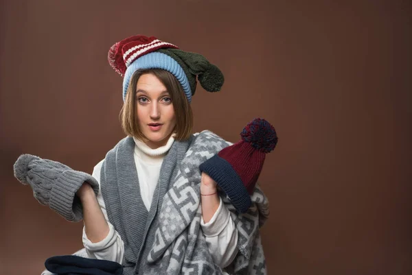 Woman with winter hats — Stock Photo