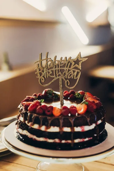 Happy Birthday sign on chocolate cake — Stock Photo