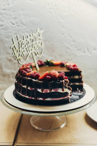 Cake with Happy Birthday sign — Stock Photo