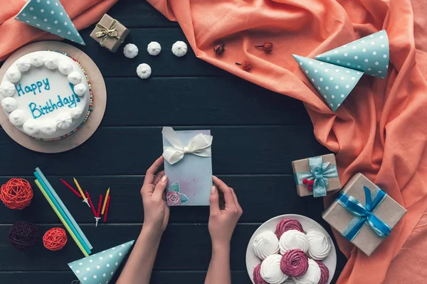 Woman holding postcard — Stock Photo