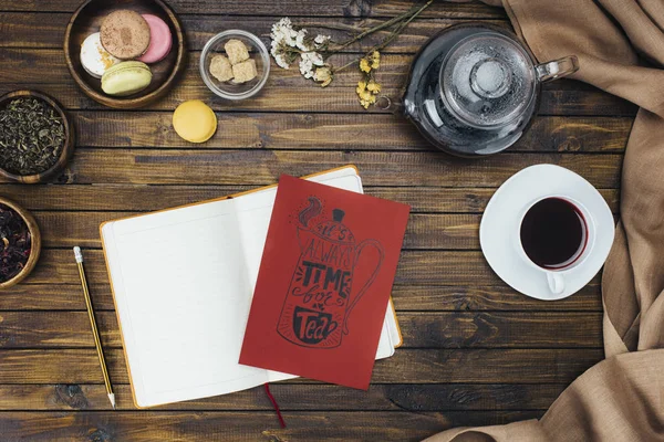 Notebook and tea card — Stock Photo