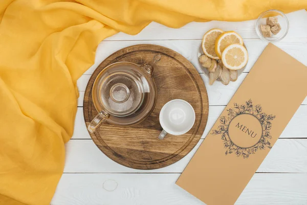 Tea set and menu — Stock Photo