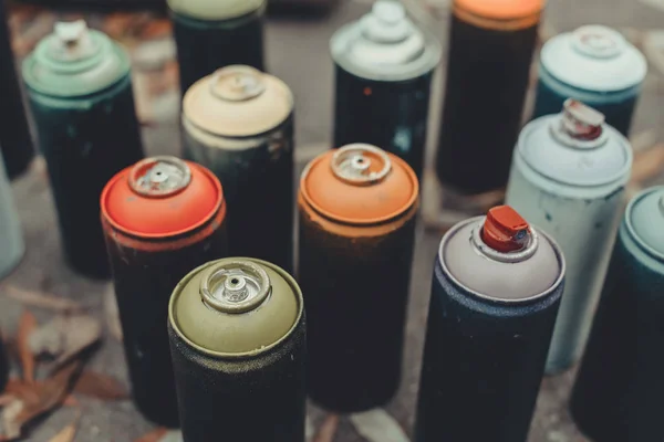 Close up of cans with colorful spray paint for graffiti — Stock Photo