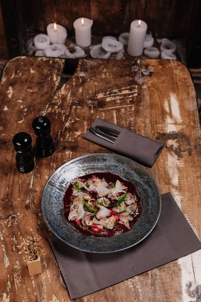 Delicious Ceviche with Dorado and daikon on wooden table — Stock Photo